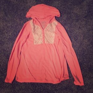 Two long sleeve shirts with flower designs